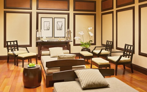 serene seating area with couches and lounge chairs 