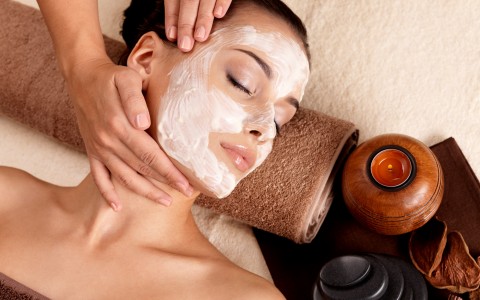 a girl enjoying a facial in a spa