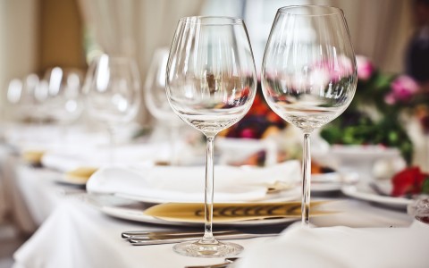 table set with for an event with wine glasses