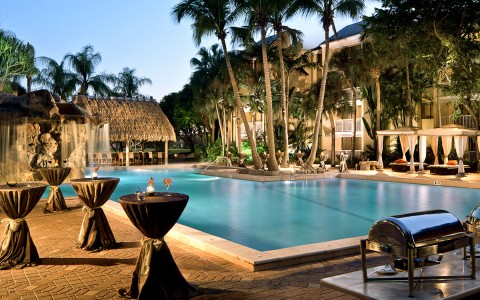 view of the pool at dusk